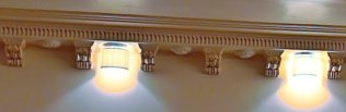 Reference photo of wall cornice lamps between brackets