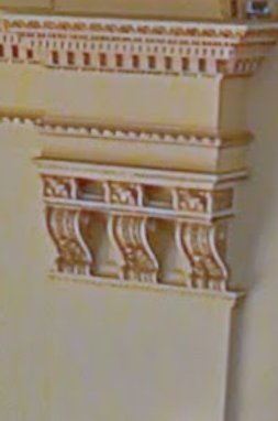 Reference photo of a corbel with three scroll consoles